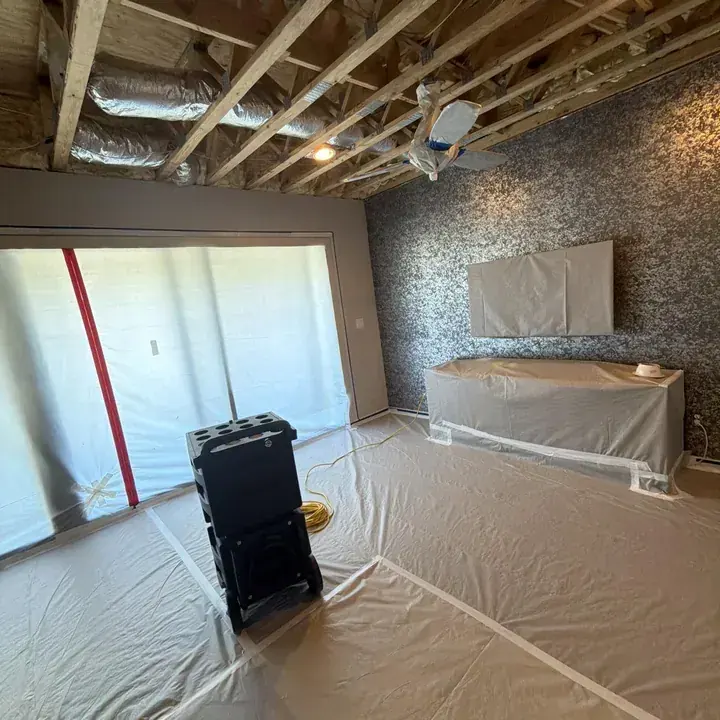 Lower walls opened to the studs for drying in a Lake Travis Hill Country home
